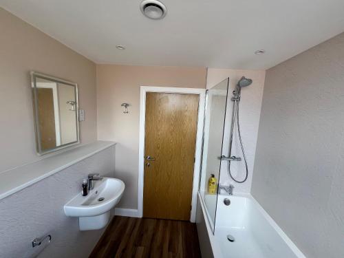 a bathroom with a sink and a toilet and a shower at Flat 1 - Luxury Bolton City Centre Apartments in Bolton
