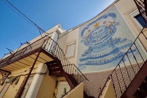 a building with a sign on the side of it at The Sunset Hideout in Lisbon
