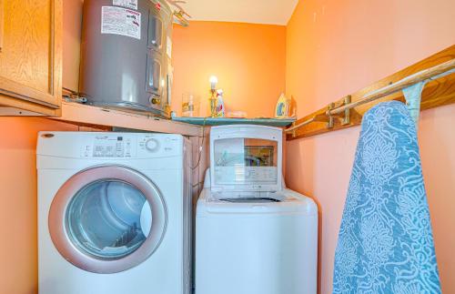 a washer and dryer in a small kitchen at Waterfront Hernando Beach Home with Dock and Hot Tub! in Hernando Beach