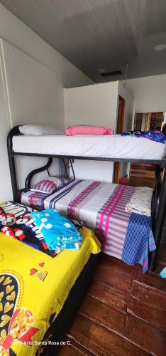 two bunk beds sitting next to each other in a room at Hotel Arte Santa Rosa in Santa Rosa de Cabal