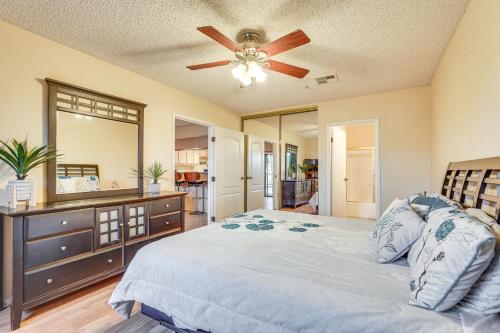 a bedroom with a bed and a ceiling fan at Queens Bay Resort Condo Walk to Golf, Pool, Beach in Lake Havasu City