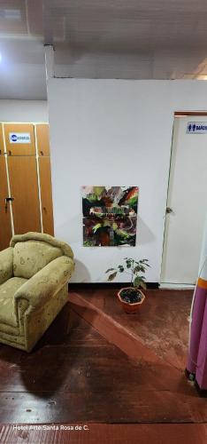a room with a couch and a painting on the wall at Hotel Arte Santa Rosa in Santa Rosa de Cabal