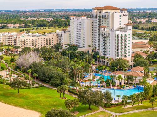 an aerial view of a resort with a pool and buildings at Omni Orlando Resort at Championsgate in Kissimmee