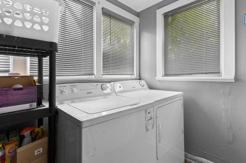 a kitchen with a sink and a dishwasher at 2 Bedroom with Laundry and Parking in Windsor in Windsor