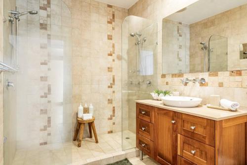 a bathroom with a sink and a shower at Sophie's Place ReLaunch - Luxury Penthouse in Byron Bay