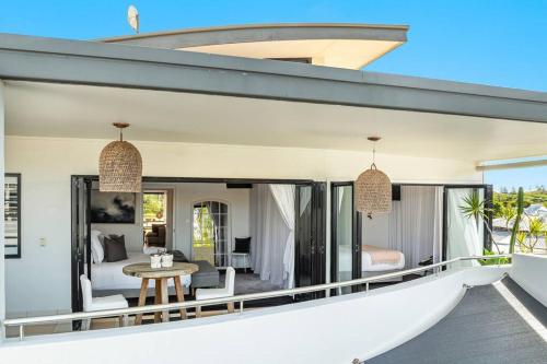 an open balcony of a house with a bedroom at Sophie's Place ReLaunch - Luxury Penthouse in Byron Bay
