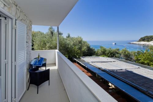 a view of the ocean from the balcony of a house at Apartments by the sea Hvar - 10430 in Hvar