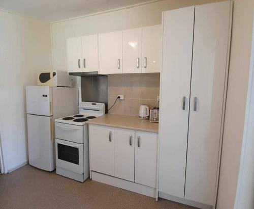 Kuchyň nebo kuchyňský kout v ubytování Cute Cottage