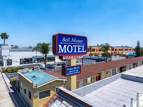 a motel sign on top of a building at Bell Manor Motel in Bell