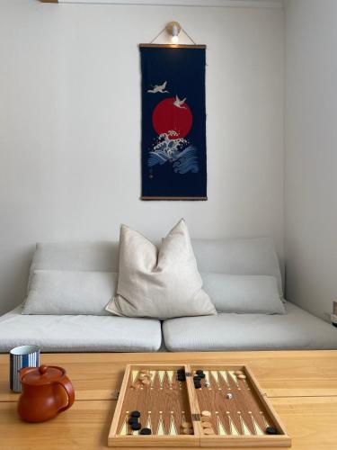 a living room with a couch and a table at Myoko Forest Lodge in Myoko