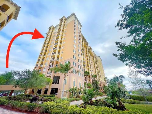 a tall building with a red arrow on it at Spider-Man-themed condo near Disney, Sea World, Universal and OCCC with pool, spa, restaurants, shuttle, private balcony, and view of fireworks shows in Orlando