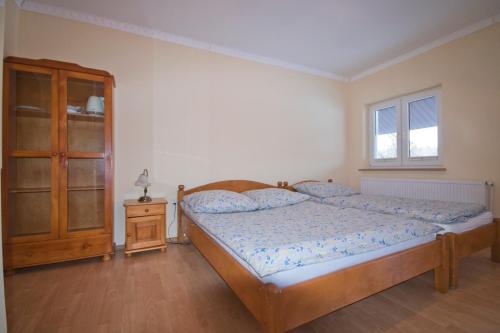 Postel nebo postele na pokoji v ubytování U Gienka Pod Lasem