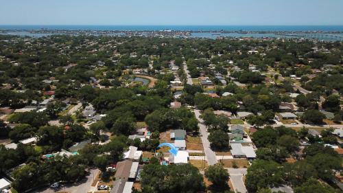an aerial view of a town with trees at CasaHelena Poolside Paradise,Heated Pool,5min to Beach,IRB Clearwater,BBQ in Largo
