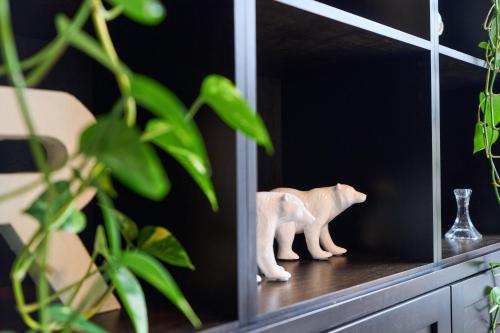 a white figurine of two polar bears on a shelf at Luxury Forest Oasis 4 beds 4 baths and Hot tub in Cocagne 