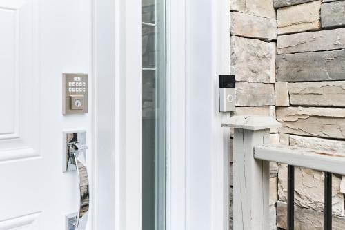 a close up of a door with a window at Luxury Forest Oasis 4 beds 4 baths and Hot tub in Cocagne 