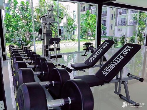 a row of dumbbells in a gym at AD Resort Cha-am/Huahin by room951 in Ban Bo Khaem