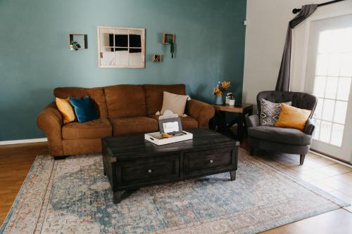a living room with a couch and a coffee table at Hadley's House - A Country 3 Bdrm with Screened-In Porch in New Braunfels