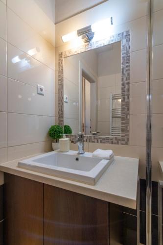a bathroom with a sink and a mirror at Be a Budapester in Budapest