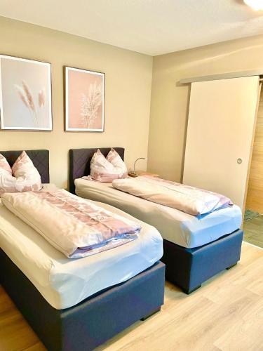 Postel nebo postele na pokoji v ubytování Gästehaus Dobias