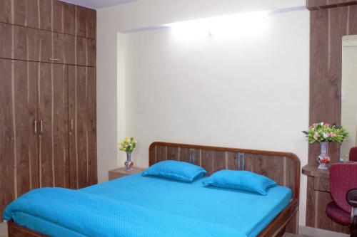 Ένα ή περισσότερα κρεβάτια σε δωμάτιο στο Sikaria Homes