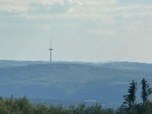 a cross on top of a hill in the distance at Gästezimmer M. Schubert in Oberelbert