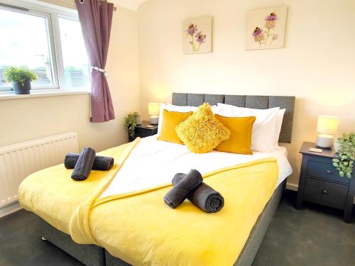 a bedroom with a bed with two towels on it at Terrance House, modern, spacious in Carlisle