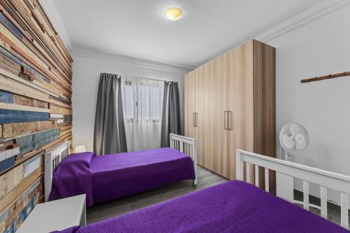 En eller flere senge i et værelse på Casa Nadal - Playa Honda