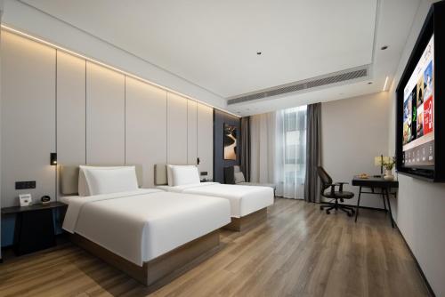 Postel nebo postele na pokoji v ubytování Atour Hotel Fuzhou Yongjia Tiandi