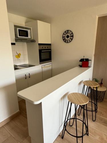 Una cocina o zona de cocina en Appart Omaha Beach