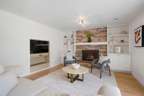 a living room with a couch and a fireplace at Large Home, 2 Living Rooms, Great for Family/Pets! in Arvada
