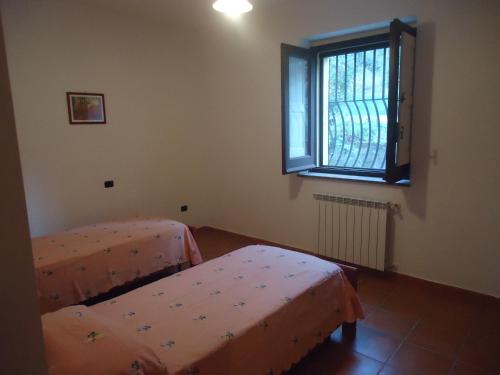 Katil atau katil-katil dalam bilik di Agriturismo Torre Rinusa