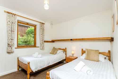 Ένα ή περισσότερα κρεβάτια σε δωμάτιο στο Cherry Tree Lodge 4