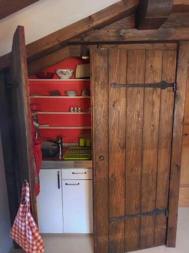 a kitchen with a wooden door in a room at Flow In chill out in Kitzbühel