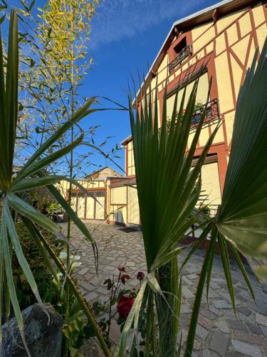a building with some plants in front of it at Maison Colombage normande in Flers
