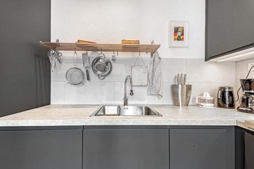 a kitchen with a sink and a counter top at Casa Anemone in Denia