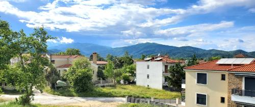 a small village with mountains in the background at Aura Luxury Suites - Olympiada Seaside Getaways in Olympiada
