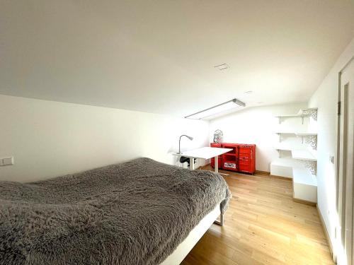 a bedroom with a bed and a desk in it at The best apartment in Trakai! Retreat! Rejuvenate! Rent with Ease! in Trakai