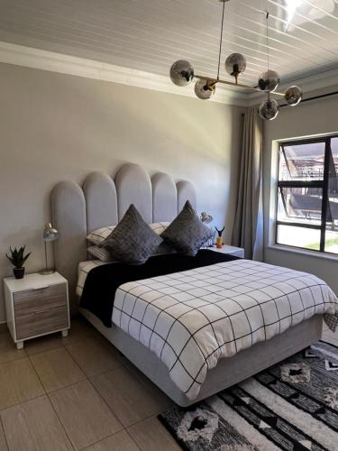 A bed or beds in a room at Ekhaya