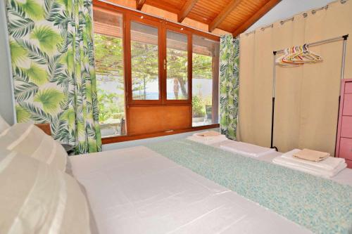 a bedroom with a large bed and a window at Emma's Studios in Lassi