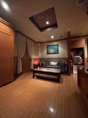 a living room with a couch and a table at フラン in Iwamizawa