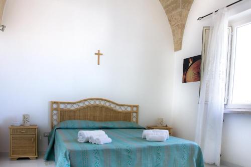 Postel nebo postele na pokoji v ubytování Terra di Leuca