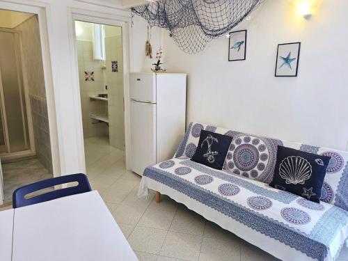 a living room with a couch and a refrigerator at Maridea - O'Sarracino in Ponza