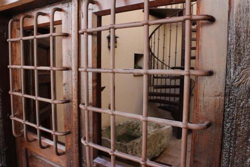 a cage with a stuffed animal inside of it at Casa Rural Bellamonte in Belmonte