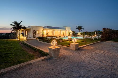a house with a swimming pool in front of it at Villa Lucia - Exclusive Private Pool in Gallipoli