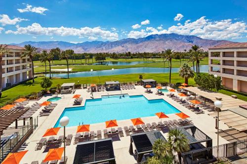 an aerial view of a resort with a pool and mountains at DoubleTree by Hilton Golf Resort Palm Springs in Cathedral City