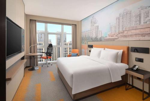 Postel nebo postele na pokoji v ubytování Days Hotel by Wyndham Chengdu Wenjiang