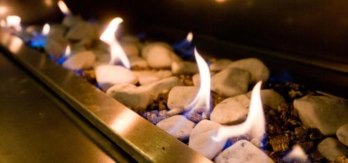 a group of candles are burning in an oven at The Queen Of Calitzdorp in Calitzdorp