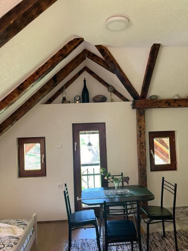 a dining room with a table and chairs at NINA Apartmani in Plav
