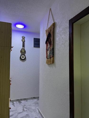 a broom hanging on a wall in a room at NINA Apartmani in Plav