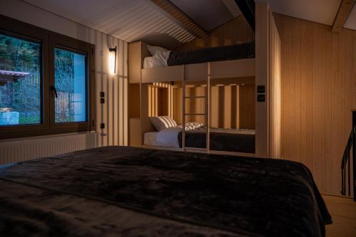 a bedroom with two bunk beds and a window at 1050 Mountain Living in Pávliani